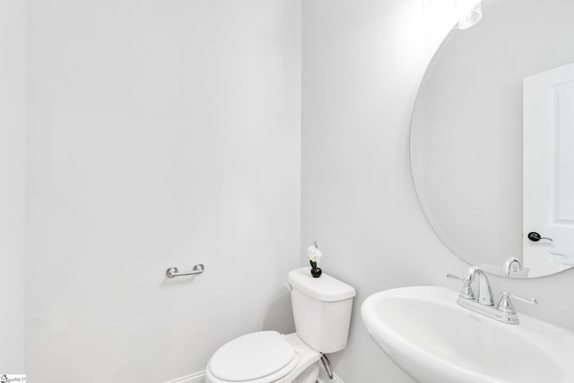 bathroom with sink and toilet