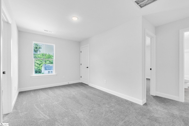 unfurnished room featuring carpet