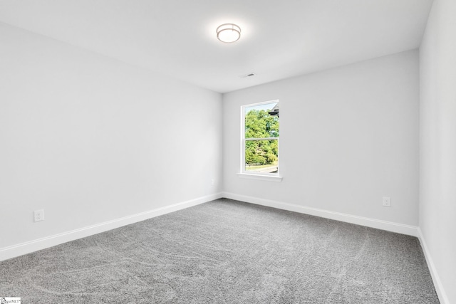 unfurnished room featuring carpet floors