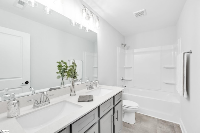 full bathroom featuring shower / bathtub combination, toilet, tile patterned flooring, and double vanity