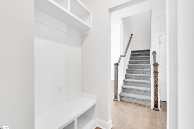 mudroom with light hardwood / wood-style flooring