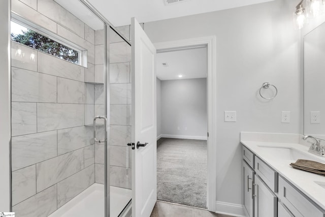 bathroom featuring vanity and walk in shower