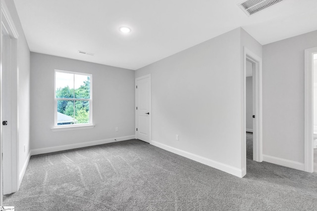 unfurnished room featuring carpet