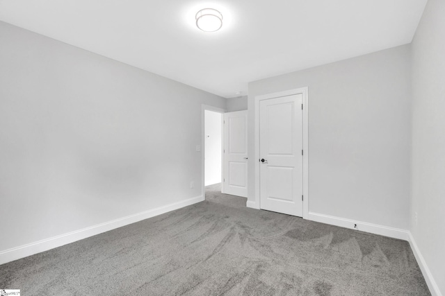 empty room featuring carpet floors