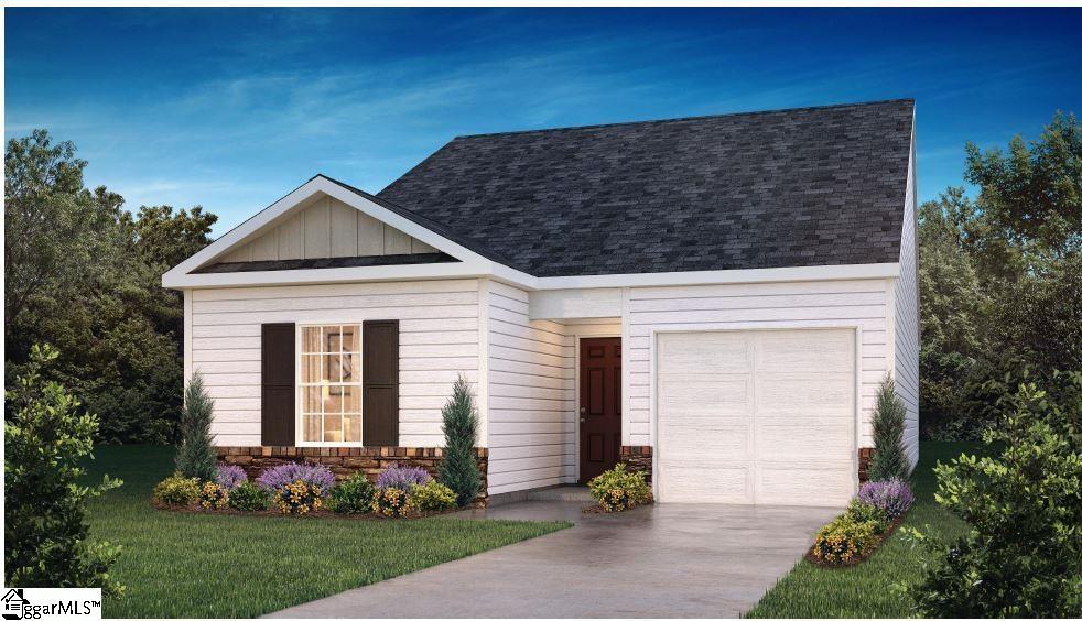 view of front of house featuring a garage and a front yard