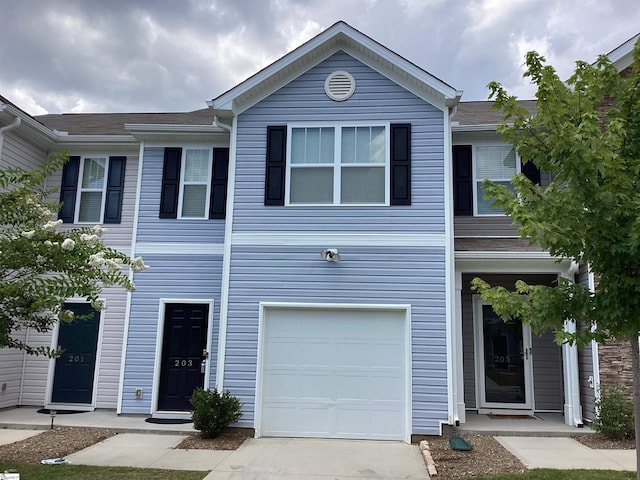 multi unit property featuring a garage