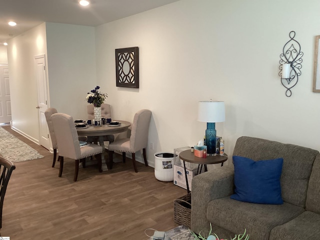 dining space featuring wood-type flooring