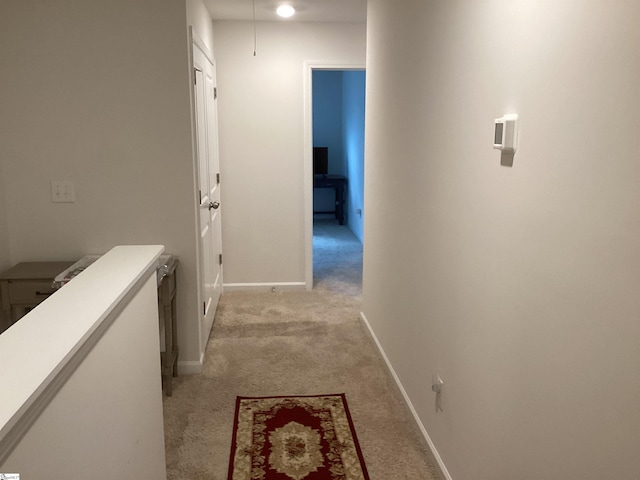 hallway with light carpet