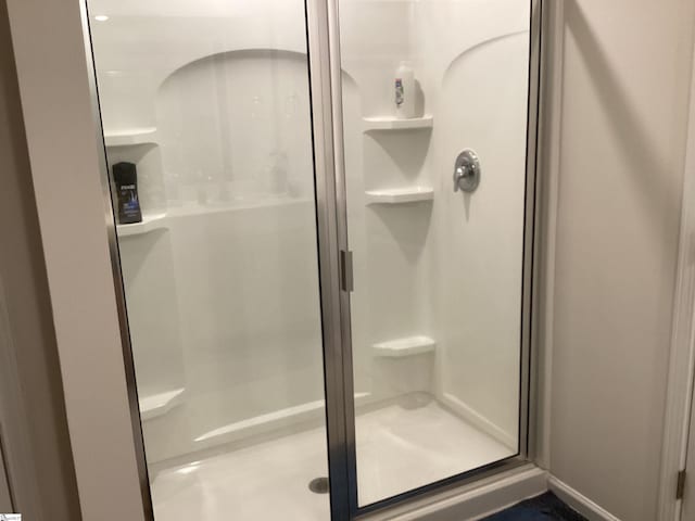 bathroom with an enclosed shower