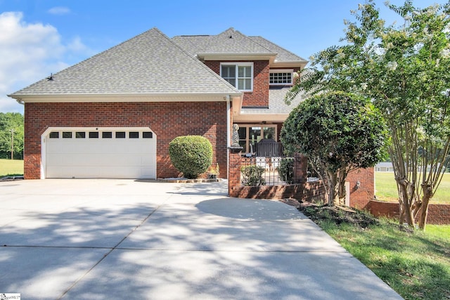 front facade featuring a garage and covered porch