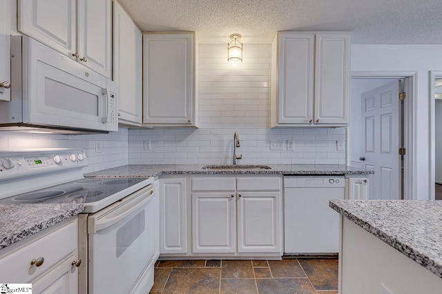 kitchen featuring white cabinetry, white appliances, a textured ceiling, backsplash, and sink