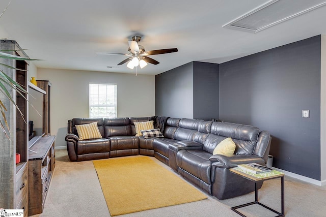 carpeted living room with ceiling fan