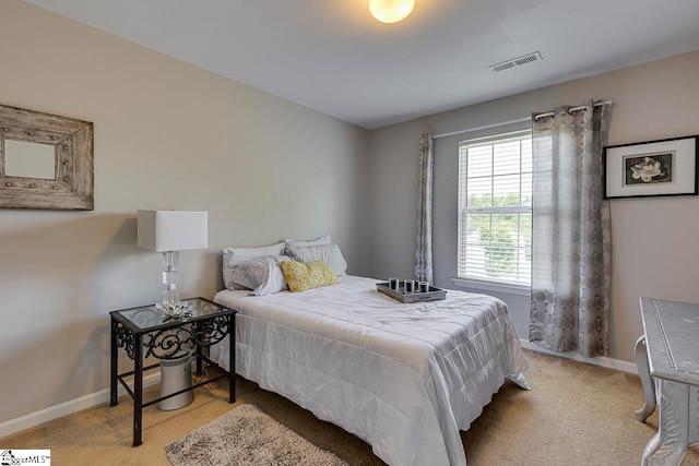 bedroom with light carpet