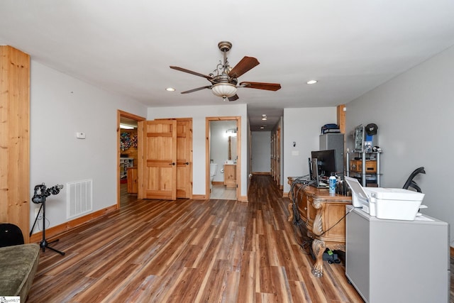 office area with light wood-style flooring, visible vents, baseboards, and recessed lighting