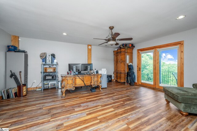 office with wood-type flooring and ceiling fan