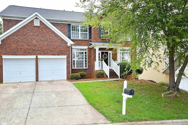 view of front of property featuring a garage and a front yard