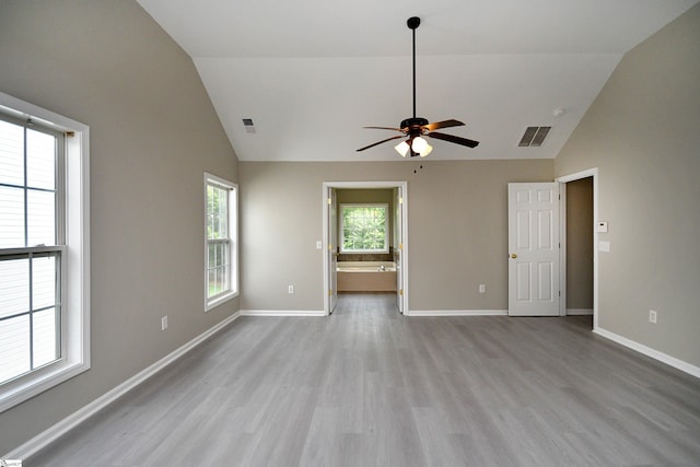 unfurnished room featuring high vaulted ceiling, ceiling fan, and light wood-type flooring