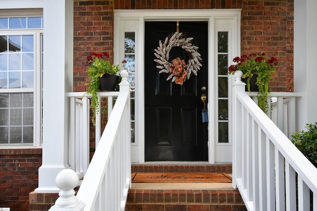 property entrance featuring covered porch