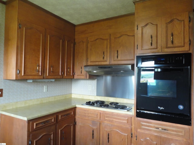 kitchen featuring black oven and gas cooktop