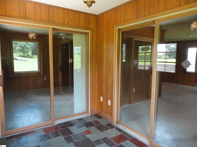 doorway with wood walls