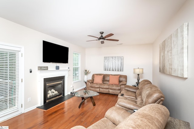 living room with hardwood / wood-style flooring and ceiling fan