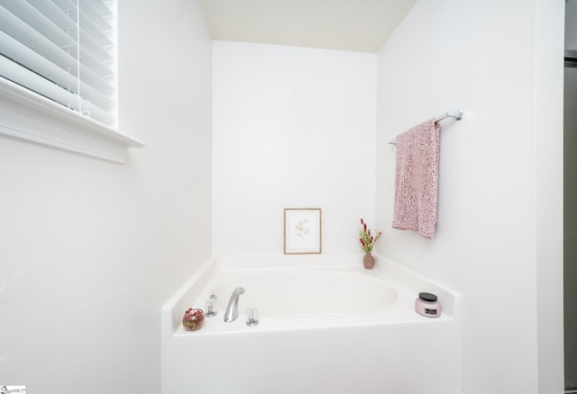 bathroom with a tub