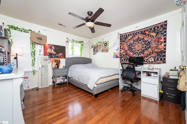 bedroom with dark wood-type flooring and ceiling fan