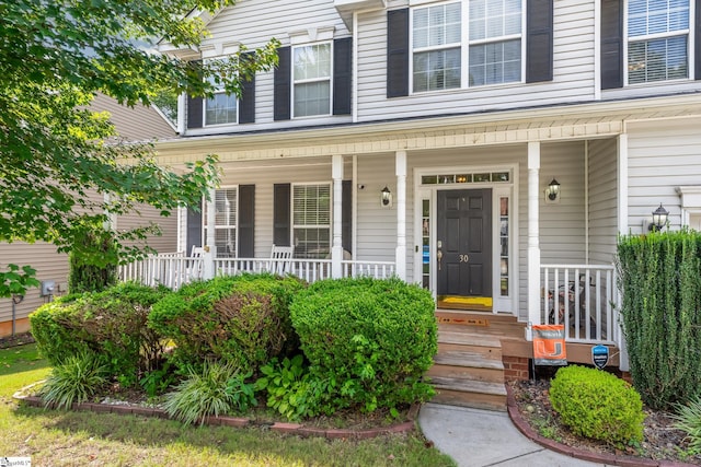 property entrance featuring covered porch