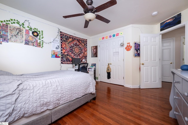 bedroom with dark wood-type flooring and ceiling fan