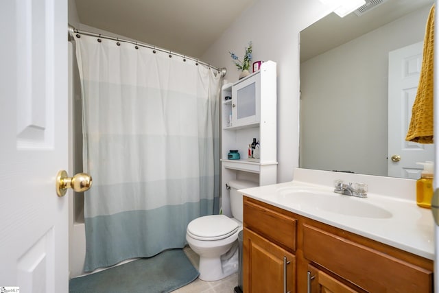 bathroom with a shower with curtain, vanity, tile patterned floors, and toilet