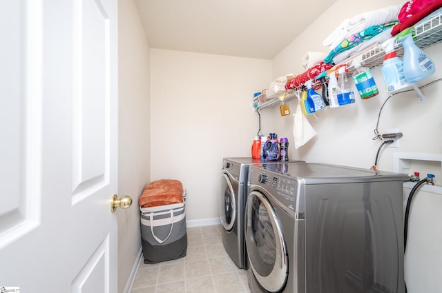 washroom with light tile patterned floors and independent washer and dryer