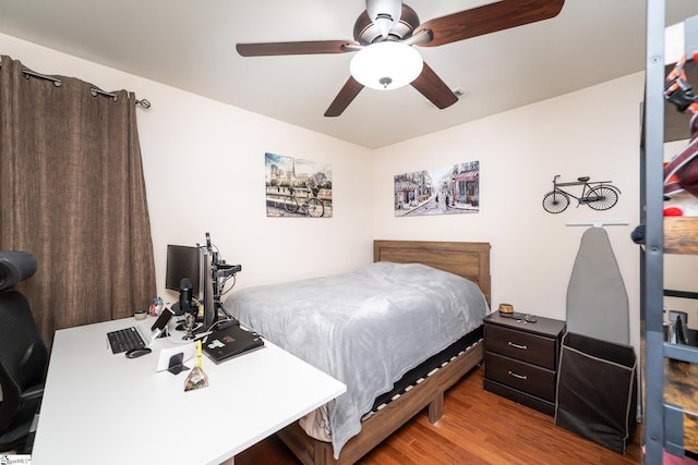 bedroom featuring ceiling fan and light hardwood / wood-style flooring