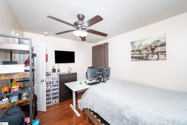 bedroom featuring ceiling fan and dark hardwood / wood-style flooring