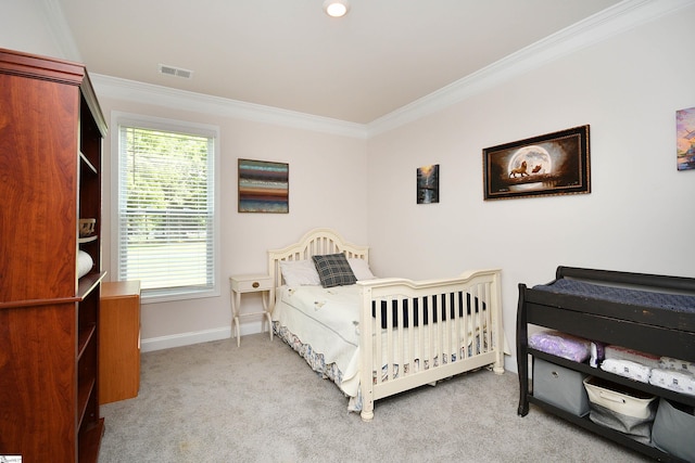 bedroom featuring crown molding and light carpet