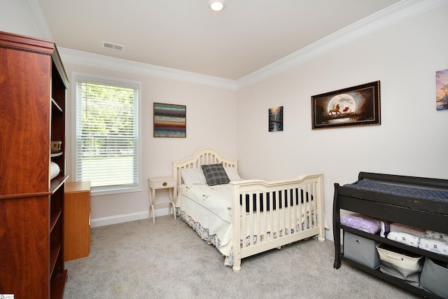 bedroom with carpet floors, ornamental molding, visible vents, and baseboards