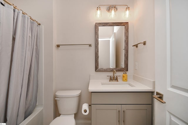 full bathroom with vanity, shower / bathtub combination with curtain, and toilet