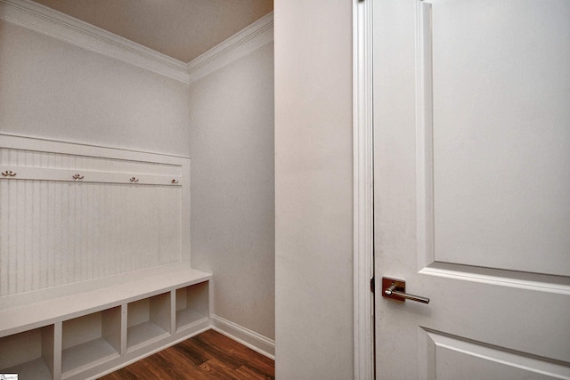 mudroom featuring dark wood finished floors, baseboards, and ornamental molding