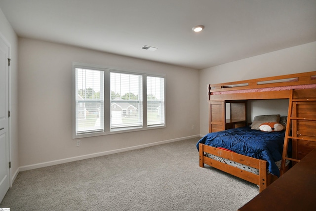 bedroom with baseboards, carpet flooring, and visible vents