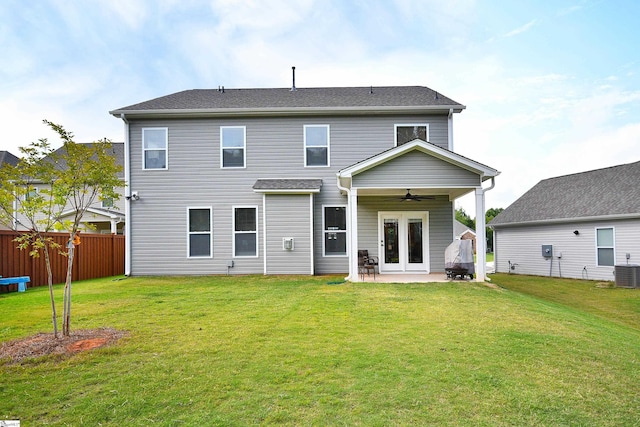 rear view of house featuring a patio area, a lawn, central air condition unit, fence, and ceiling fan
