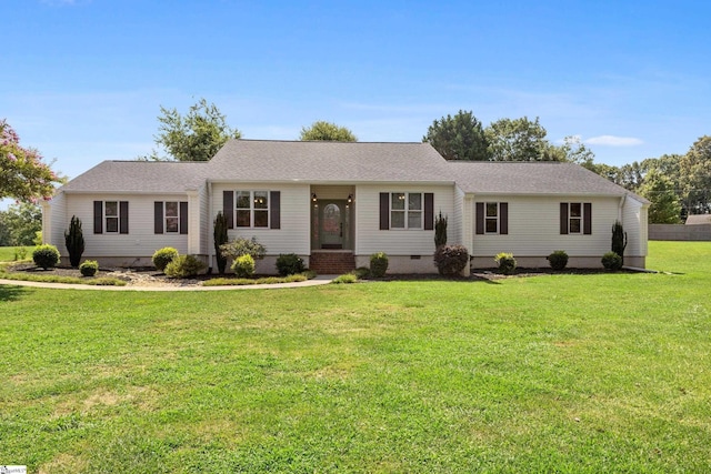 ranch-style home with a front lawn