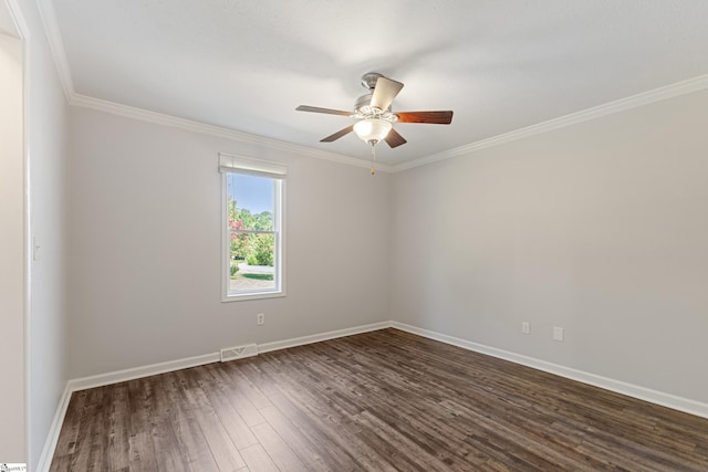 empty room with ornamental molding, dark wood-type flooring, and ceiling fan