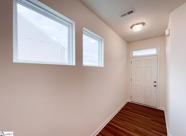 doorway to outside with dark hardwood / wood-style flooring