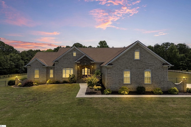 view of front of property with a yard