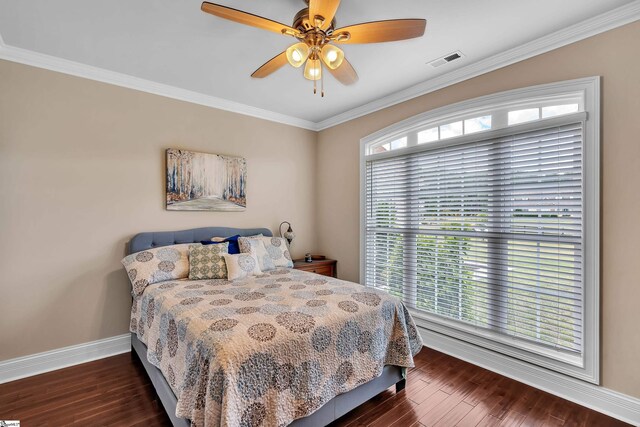 bedroom featuring crown molding, ceiling fan, and dark hardwood / wood-style flooring