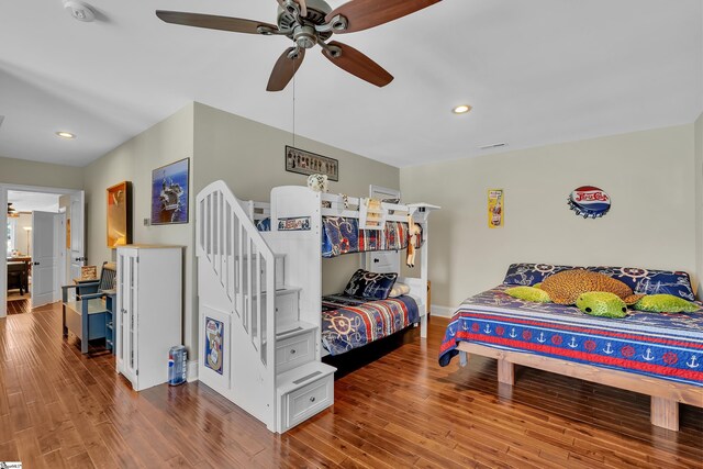 bedroom featuring hardwood / wood-style flooring and ceiling fan