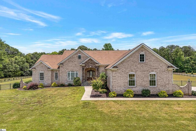 view of front of property with a front lawn