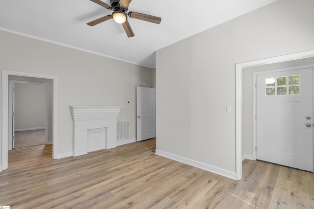 unfurnished living room with ceiling fan and light hardwood / wood-style floors