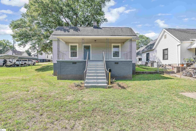 view of front of house featuring crawl space, fence, stairway, and a front yard