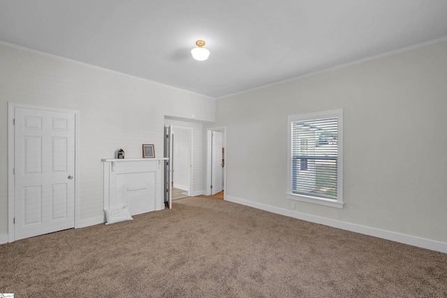 unfurnished bedroom with carpet, ornamental molding, and baseboards