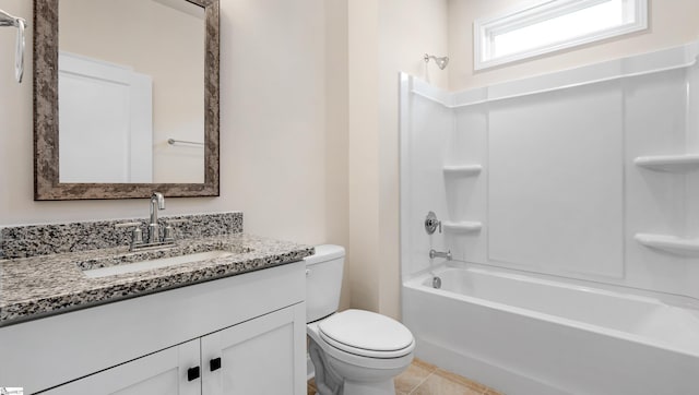 bathroom with tile patterned flooring, toilet, bathing tub / shower combination, and vanity